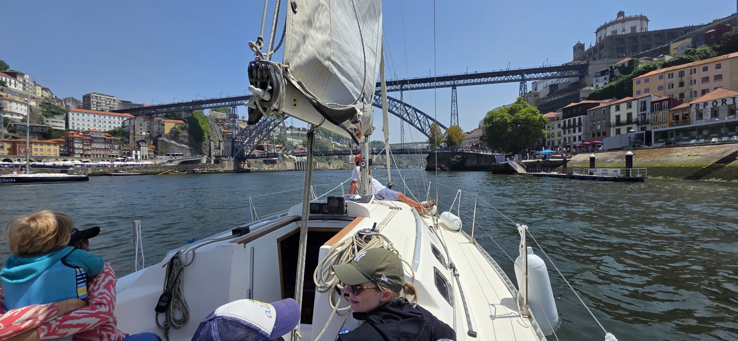 Sailing on the Douro River in Porto with views of the Dom Luís I Bridge and historic riverside