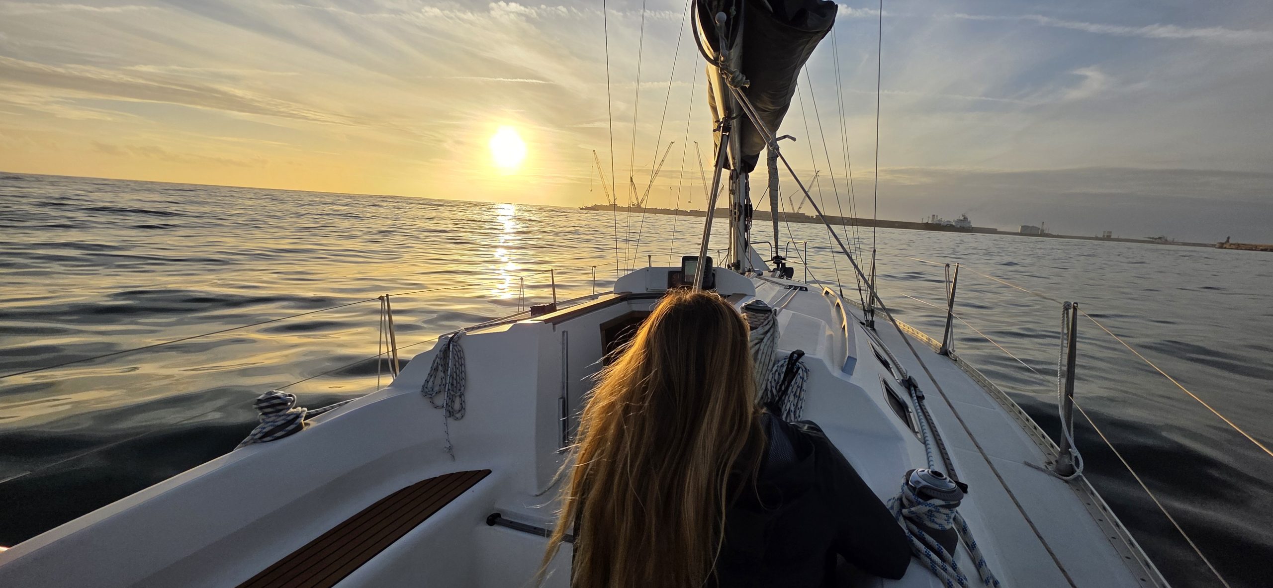 Sunset sailing experience in Porto, enjoying a private boat tour at sea with views of the coastline